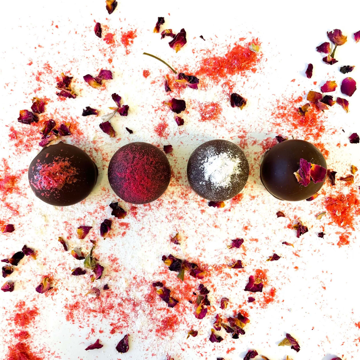Handcrafted vegan truffles with Valentine's sprinkles on a white background